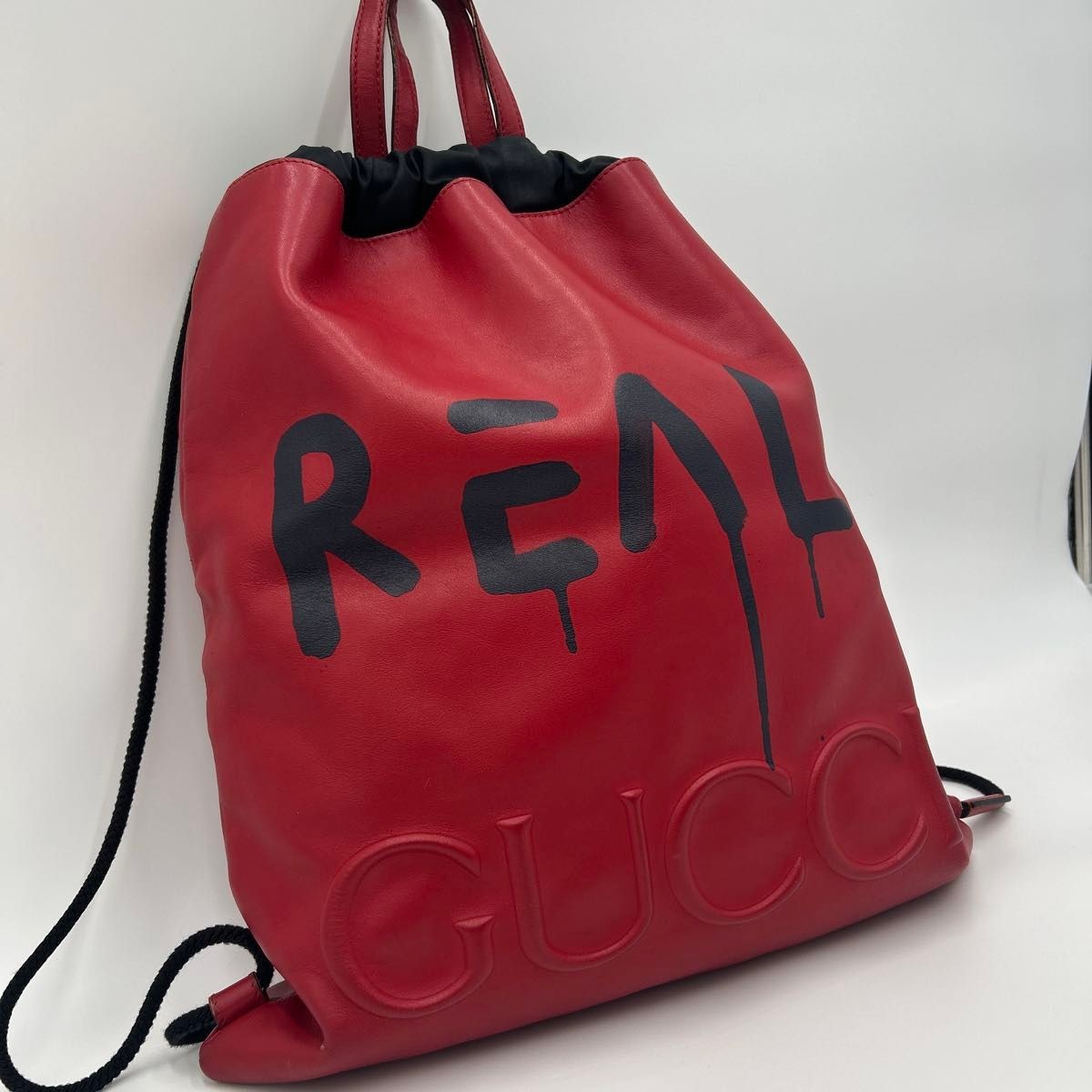 GUCCI men’s backpack daypack Leather drawstring red logo print 44.5×38cm