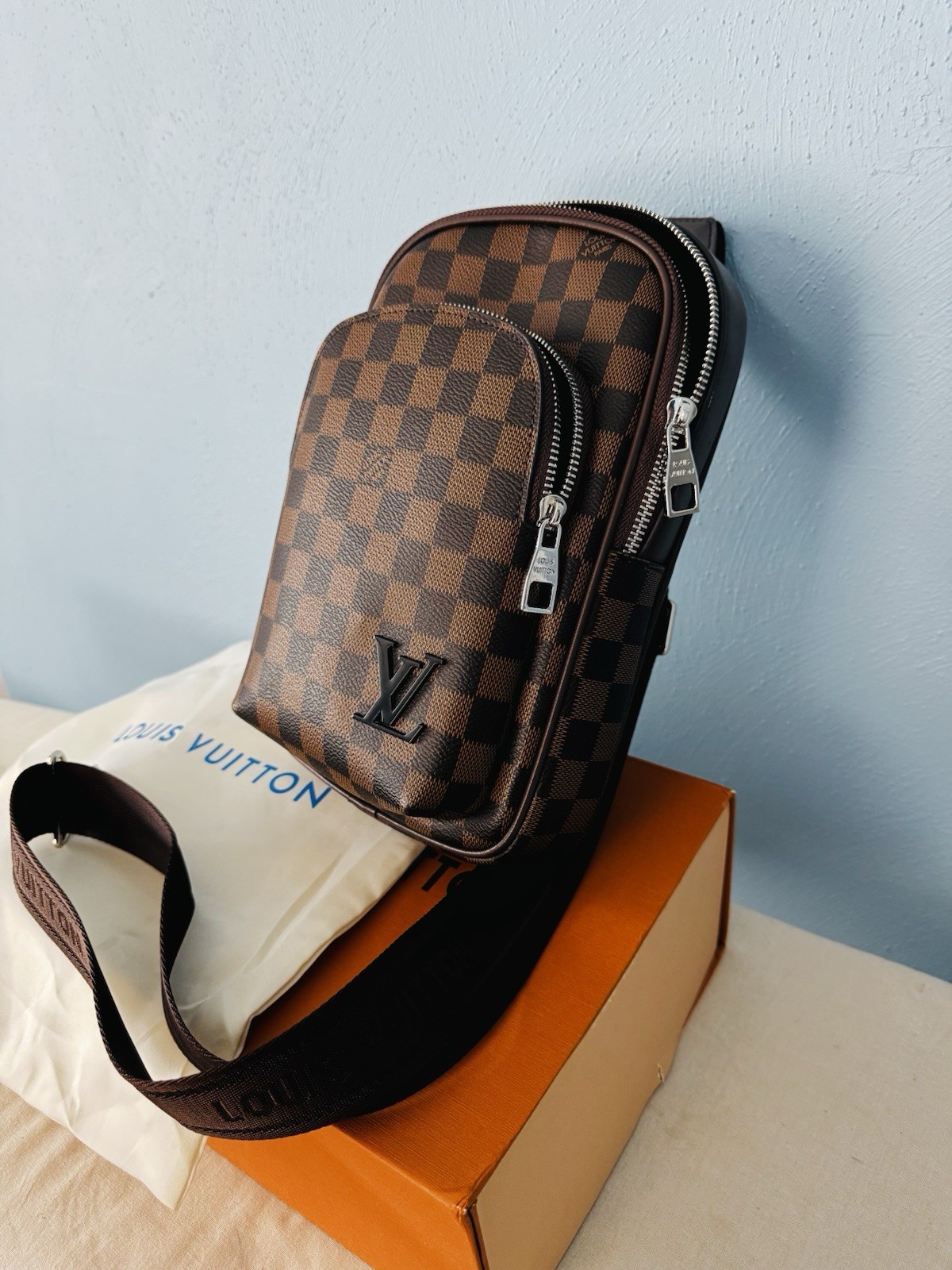 Louis Vuitton Brown Crossbody Sling Bag with Zip Closure
