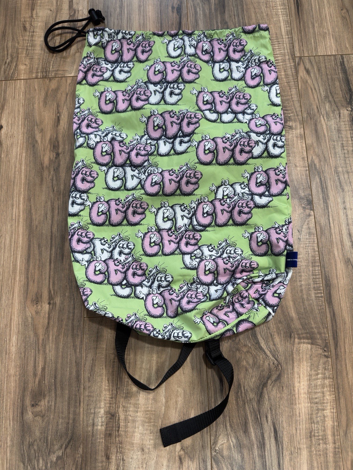 Comme Des Garçons Shirt X Kaws Logo Drawstring Bag Backpack Green Pink FHK201W21