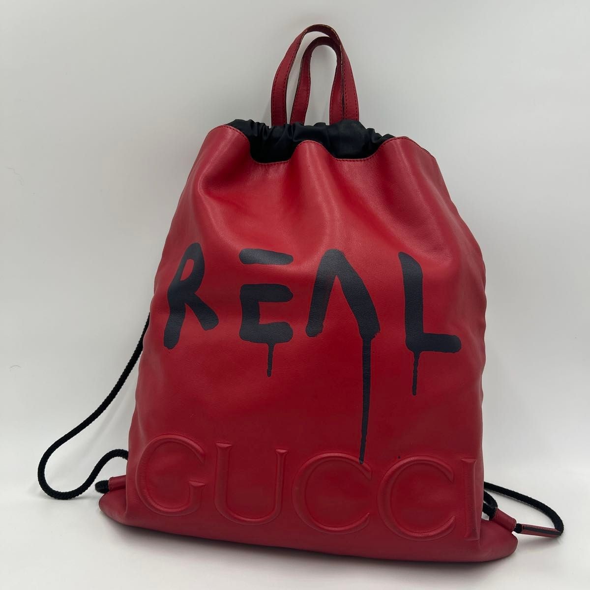 GUCCI men’s backpack daypack Leather drawstring red logo print 44.5×38cm