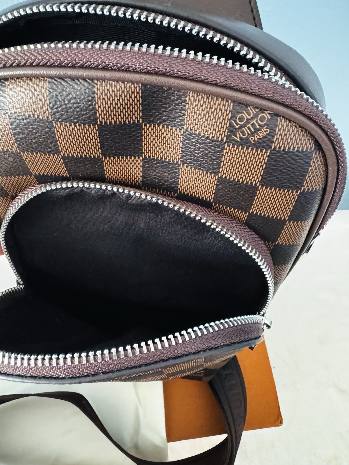 Louis Vuitton Brown Crossbody Sling Bag with Zip Closure