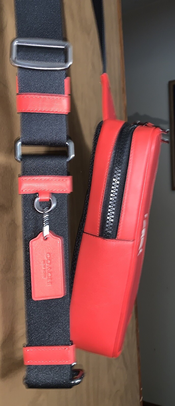 COACH Track Sling Backpack in Colorblock with Stamp in Red Ivory Orange