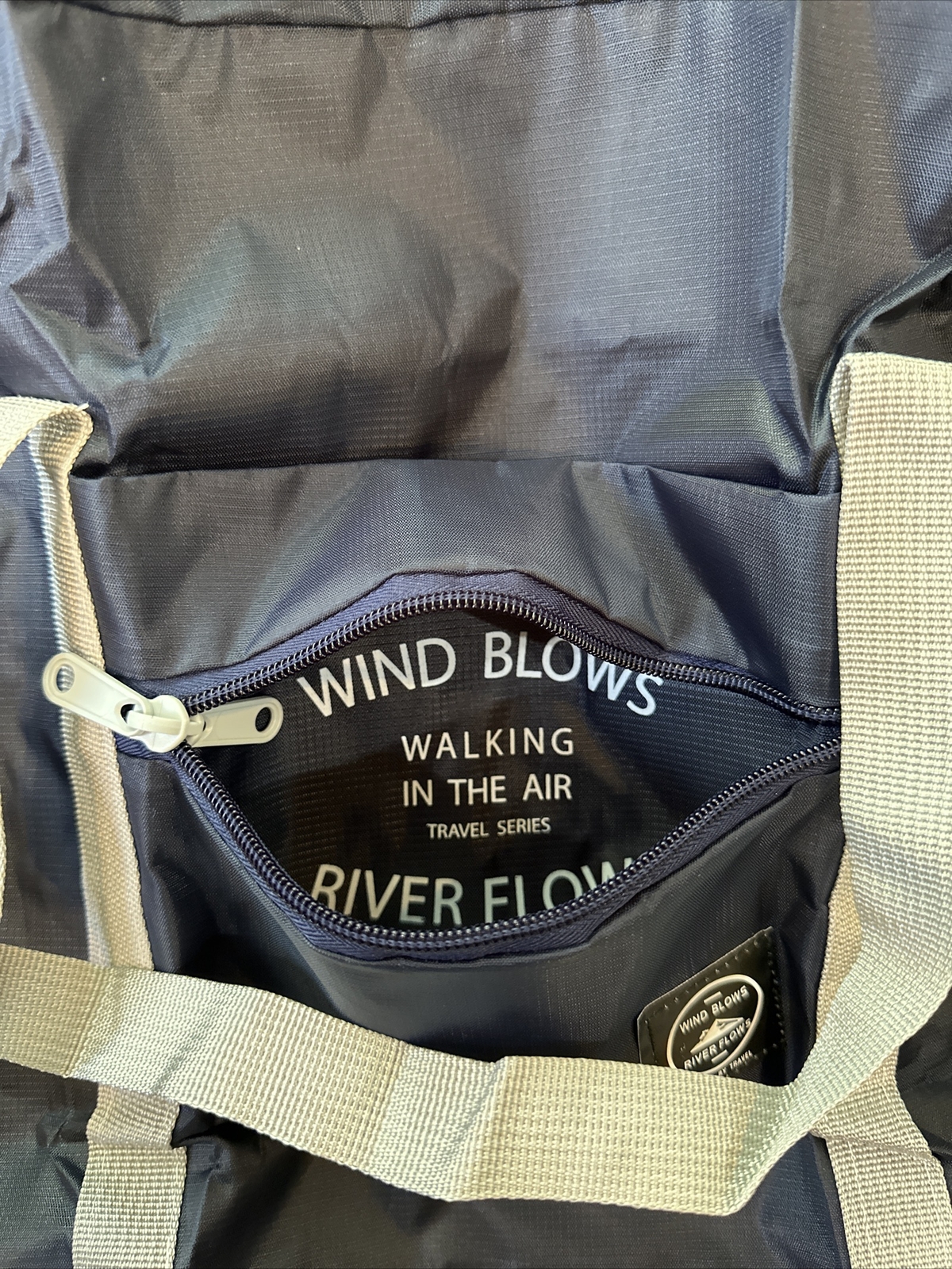 Wind Blows River Flows-Foldable Travel Bag – Black New – Hangs On Luggage