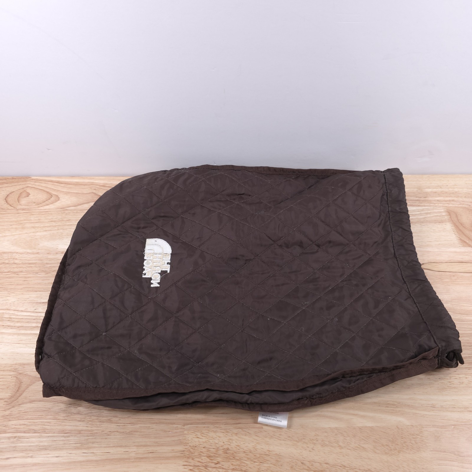The North Face Quilted Drawstring Bag — Brown