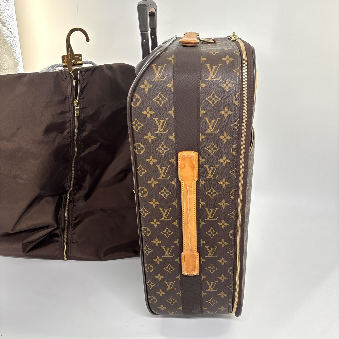 Louis Vuitton M23294 Monogram Pegase 55 carry-on suitcase in brown.