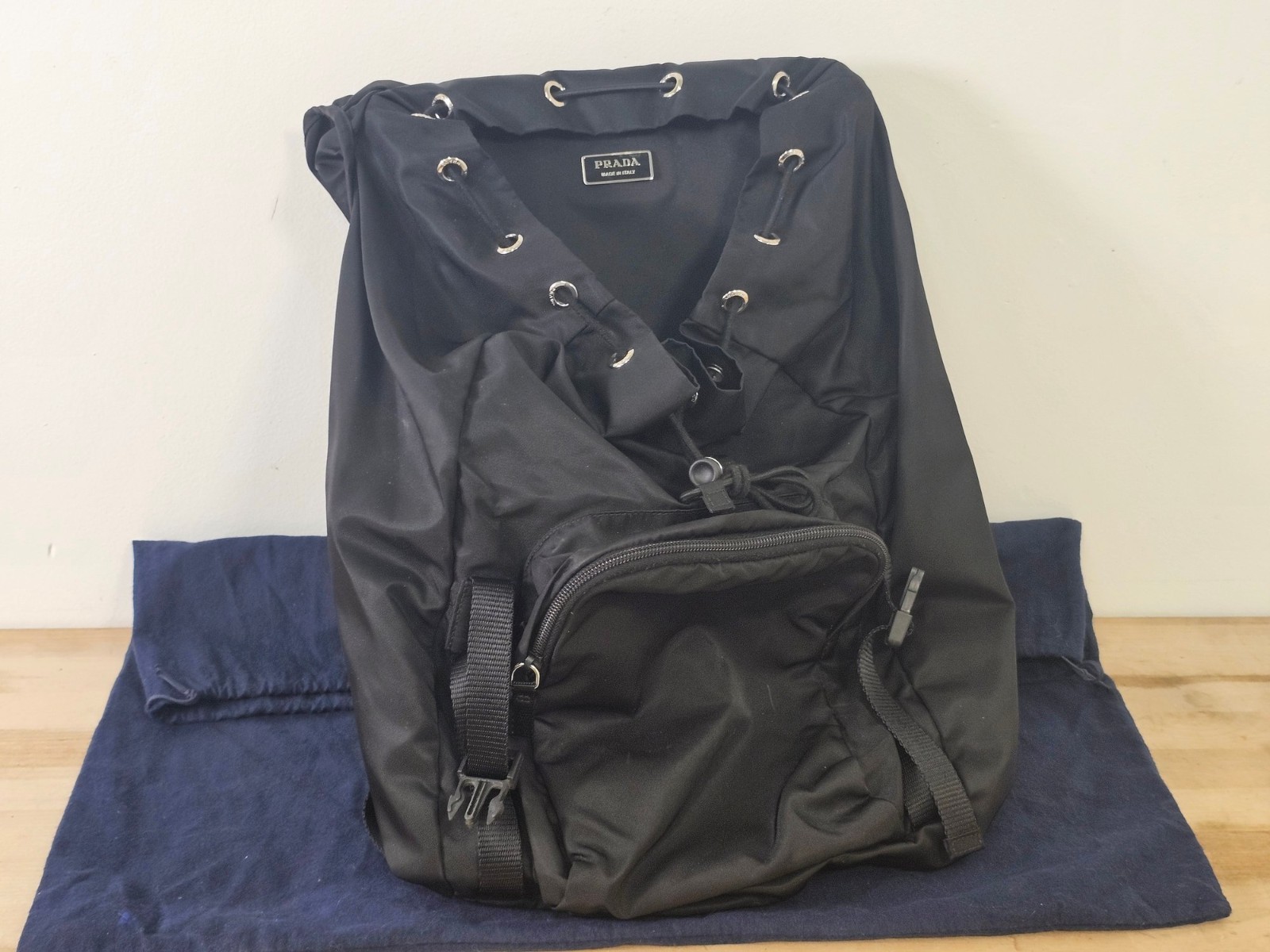 Black Prada Re-Nylon & Saffiano Leather Backpack – Top flap with buckle closure
