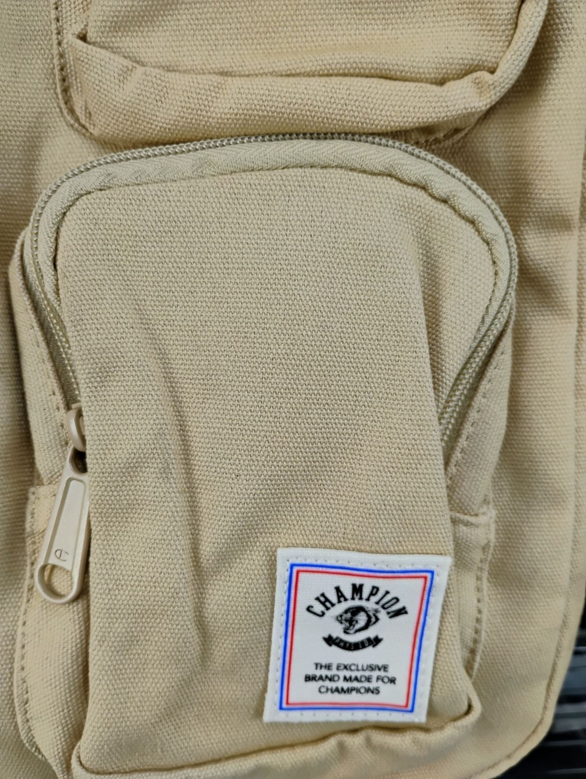 Champion Beige Canvas Sling Backpack Reversible Strap Durable