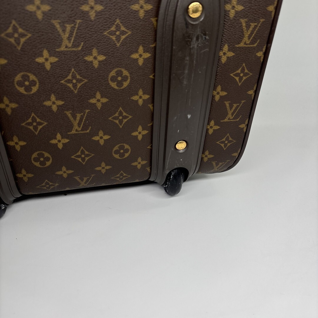 Louis Vuitton M23294 Monogram Pegase 55 carry-on suitcase in brown.