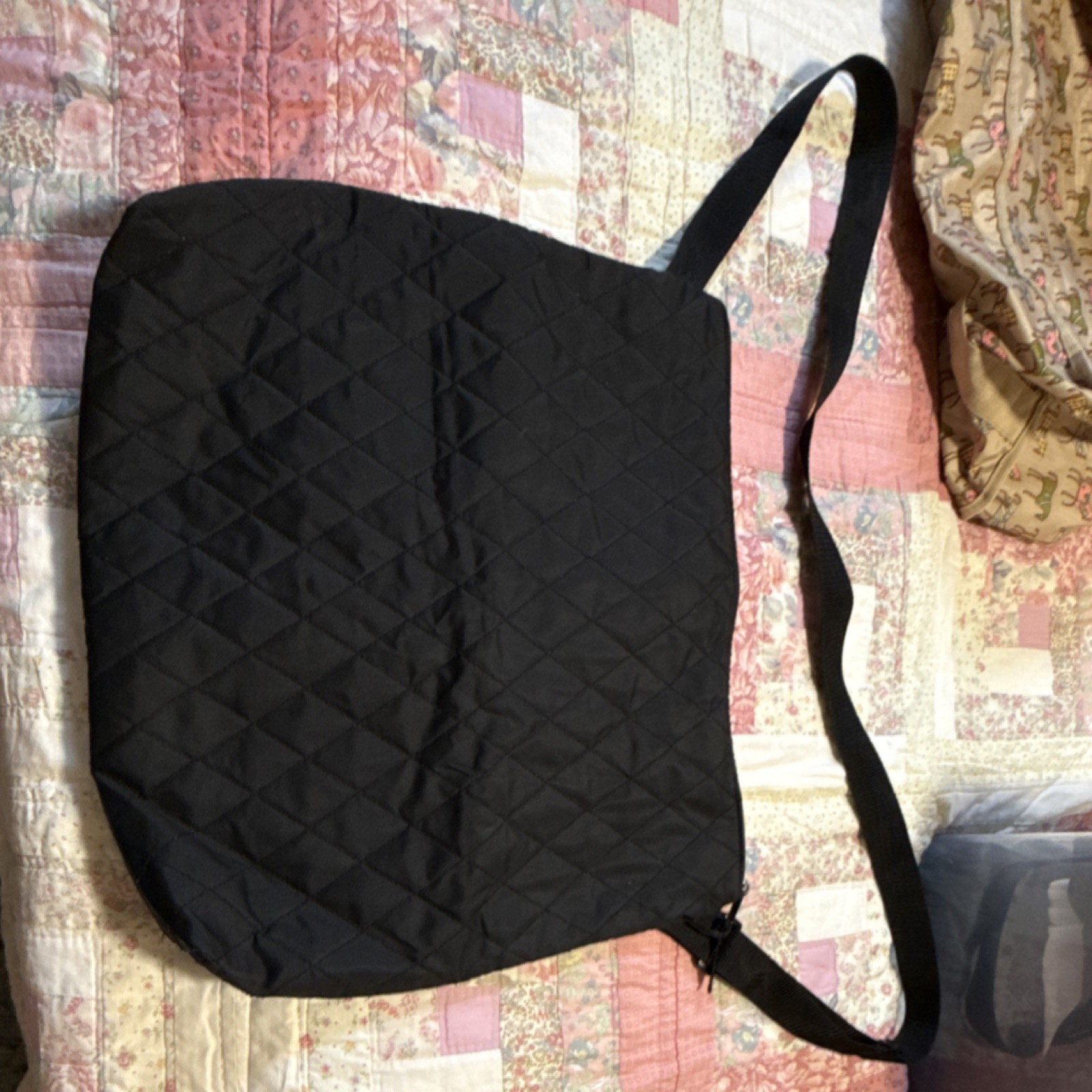 Black Quilted Shoulder Bag with Adjustable Strap and Zipper Closure