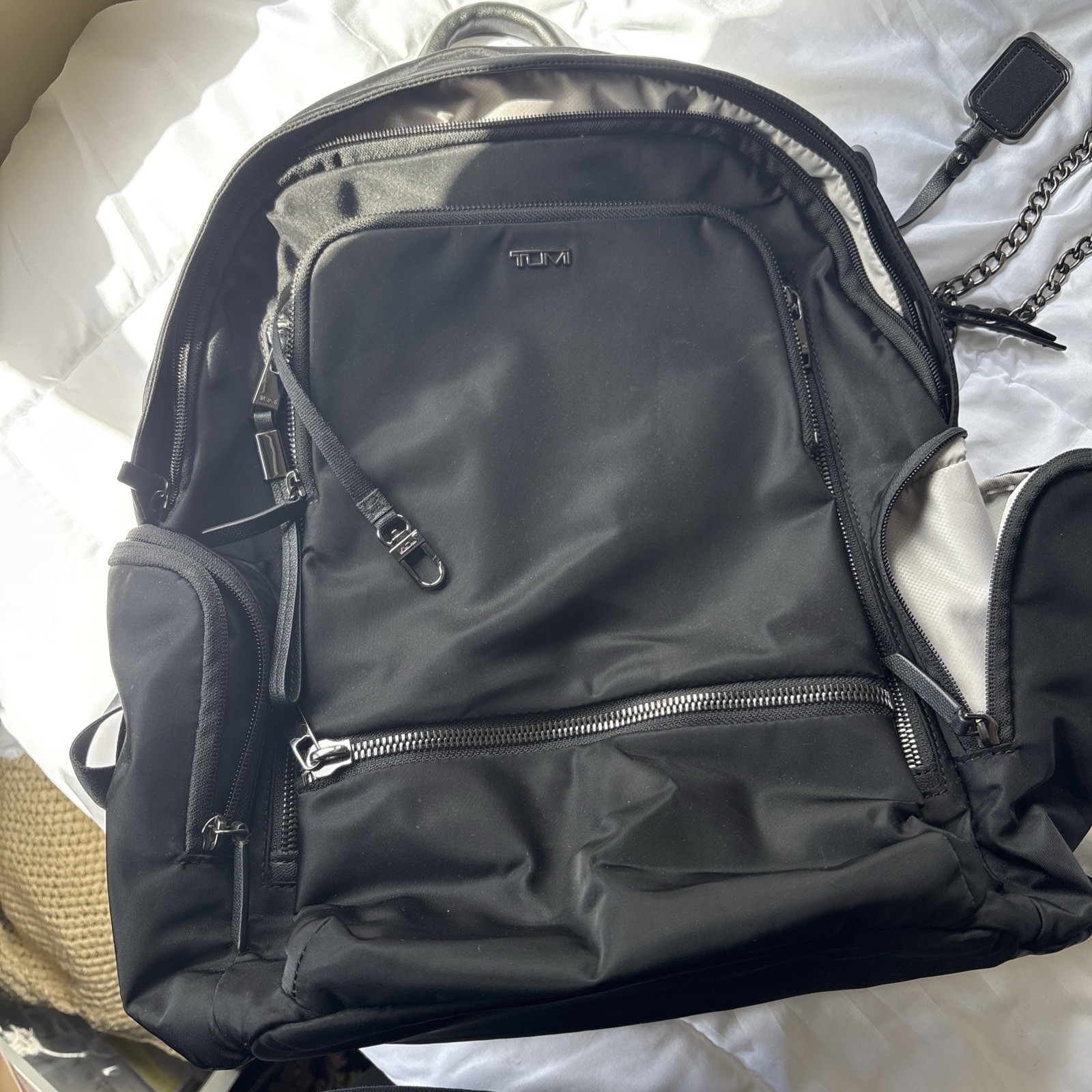 TUMI Black Backpack, Zip Closure, Adjustable Straps, Pockets, Top Handle