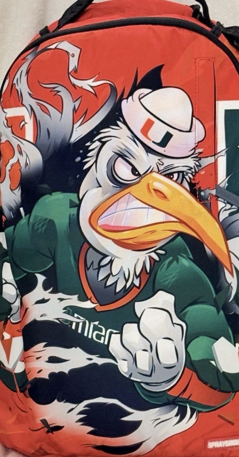 UM UNIVERSITY OF MIAMI FOOTBALL SPRAYGROUND BACKPACK MASCOT SEBASTIAN NEW IN BAG
