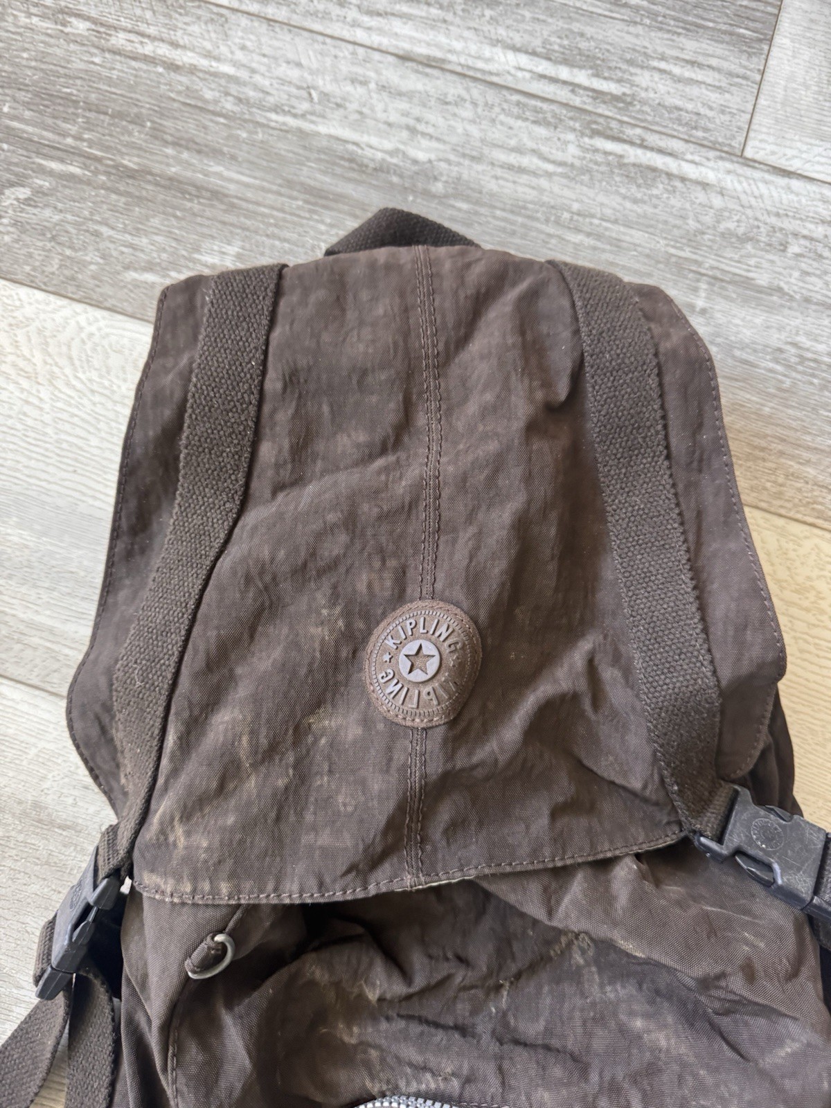 Kipling Brown Nylon Backpack Drawstring Flap Style with Front Zip Pocket & Logo