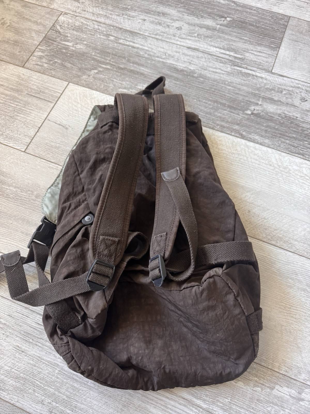 Kipling Brown Nylon Backpack Drawstring Flap Style with Front Zip Pocket & Logo