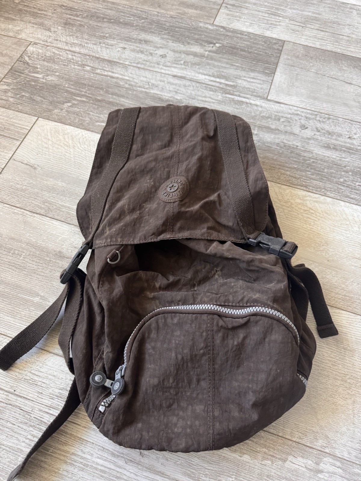 Kipling Brown Nylon Backpack Drawstring Flap Style with Front Zip Pocket & Logo