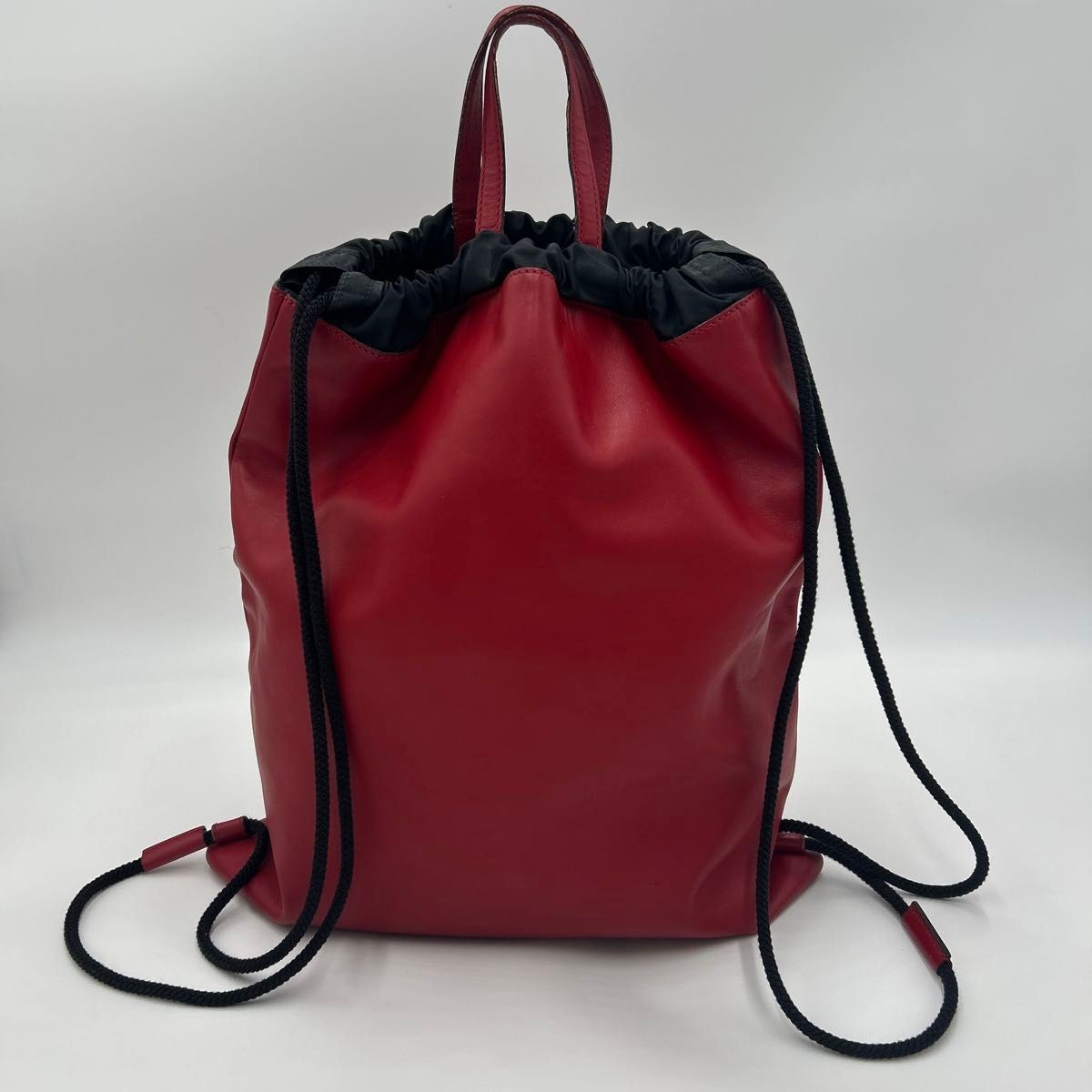 GUCCI men’s backpack daypack Leather drawstring red logo print 44.5×38cm