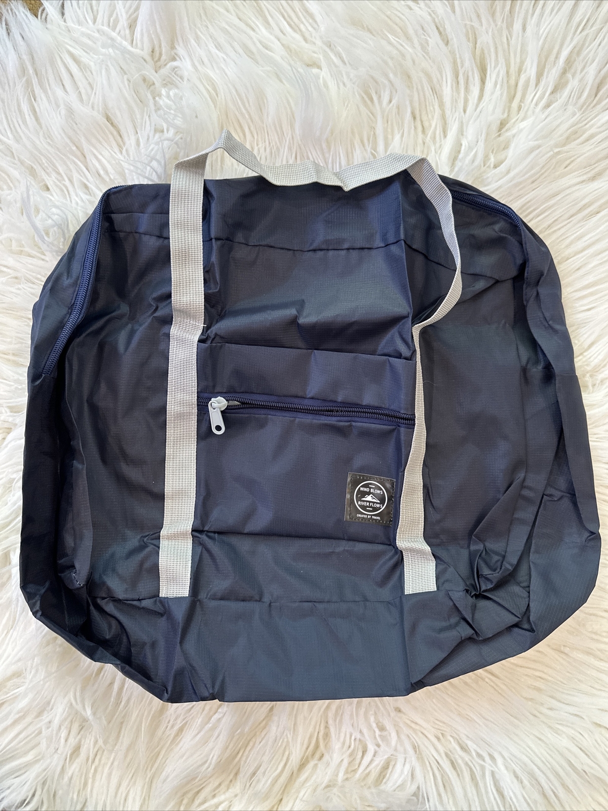 Wind Blows River Flows-Foldable Travel Bag – Black New – Hangs On Luggage