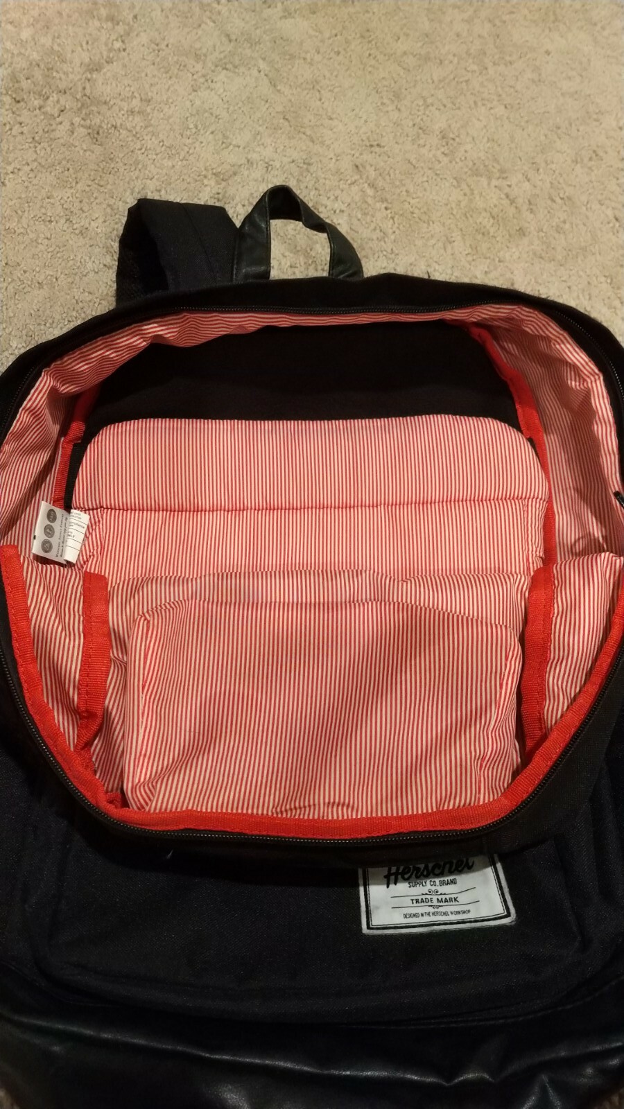 Black Herschel Backpack red stripe interior yellow zipper