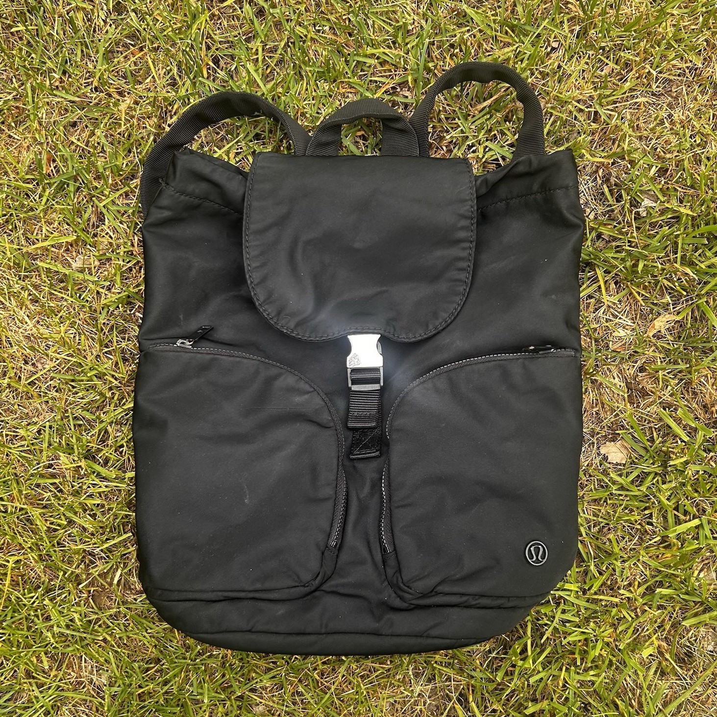 lululemon Black Medium Backpack Buckle Flap & Zip Pockets, Adjustable Strap
