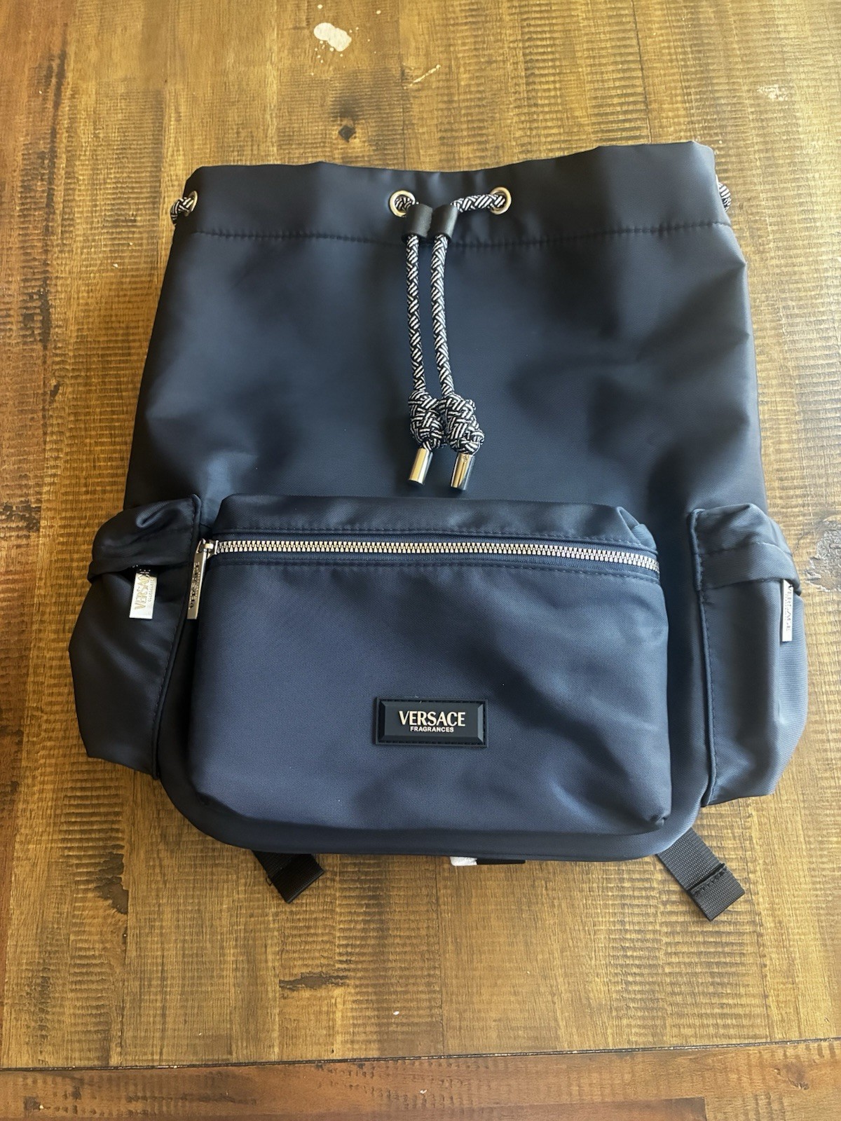 Versace Parfums Black Drawstring Backpack w/ Front Zip Pocket, Zip Closure