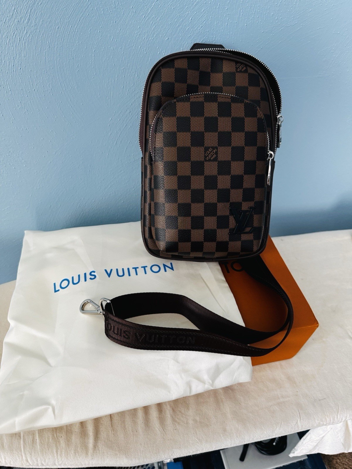 Louis Vuitton Brown Crossbody Sling Bag with Zip Closure