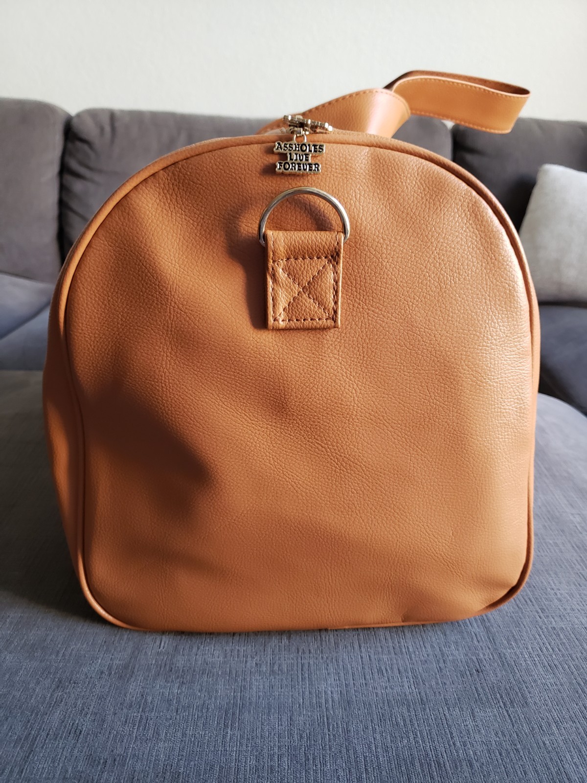 ASSHOLES*S LIVE FOREVER – Emotional Baggage Camel Tan Faux Leather BRAND NEW!