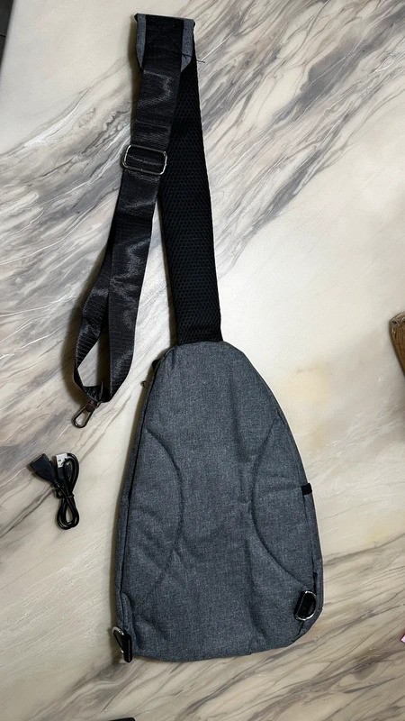 Versatile Zippered Sling Bag with USB and Cord