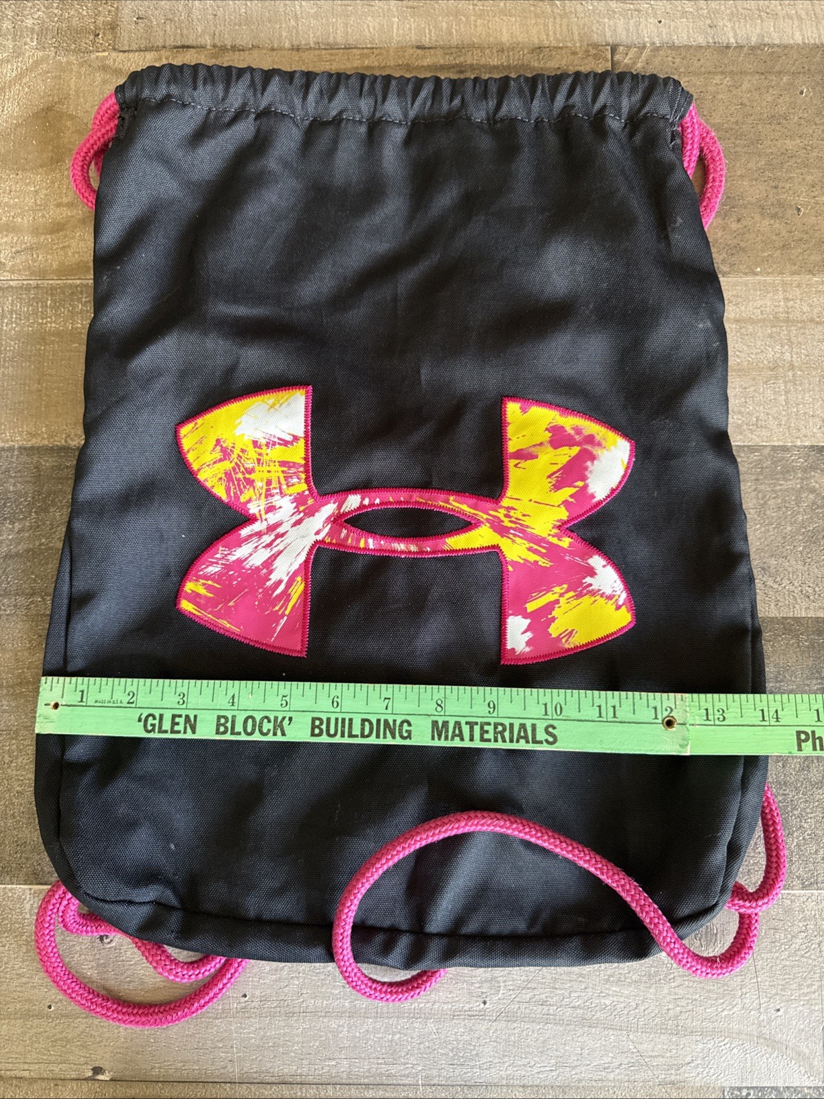 Pre- owned Black Under Armour Draw String Gym Bag with Pink and Yellow logo