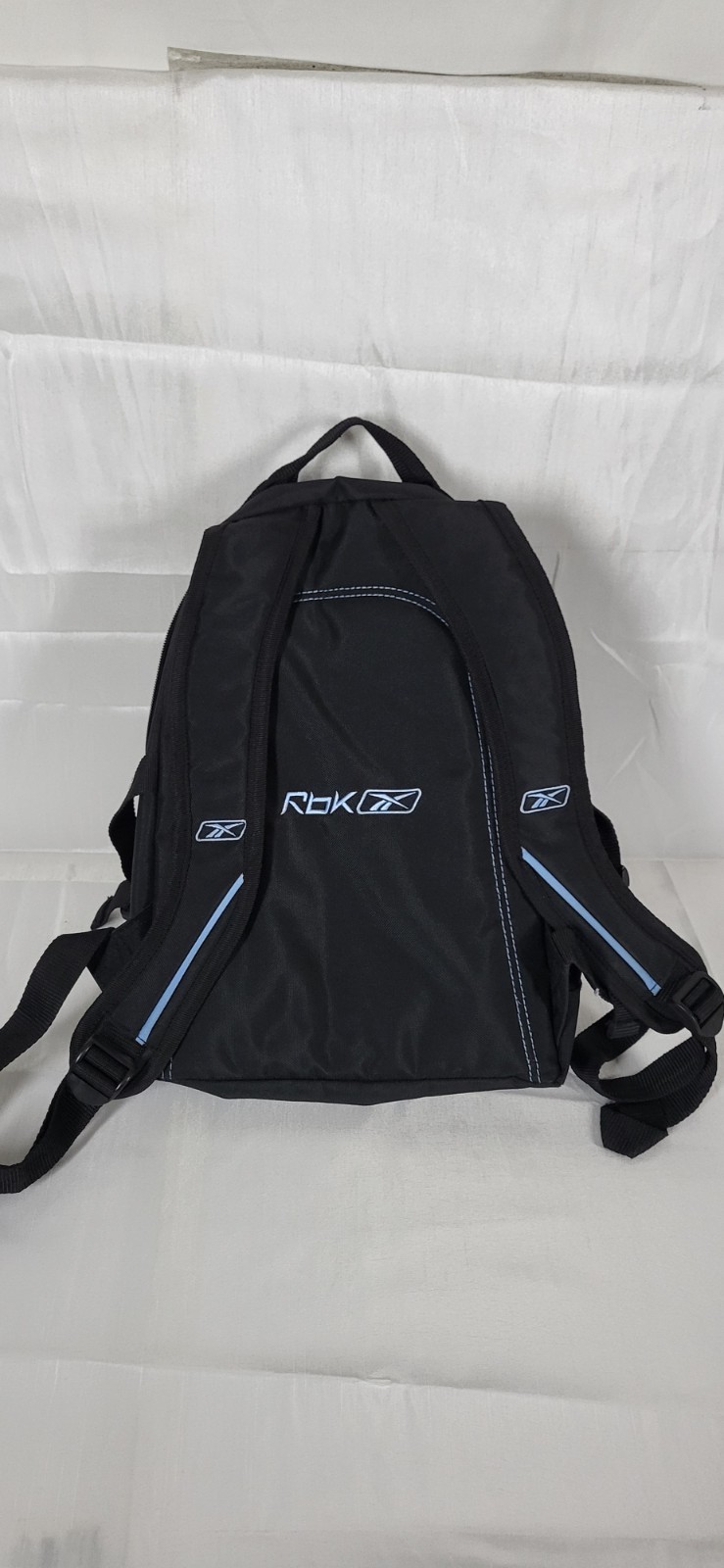 black and blue Reebok backpack