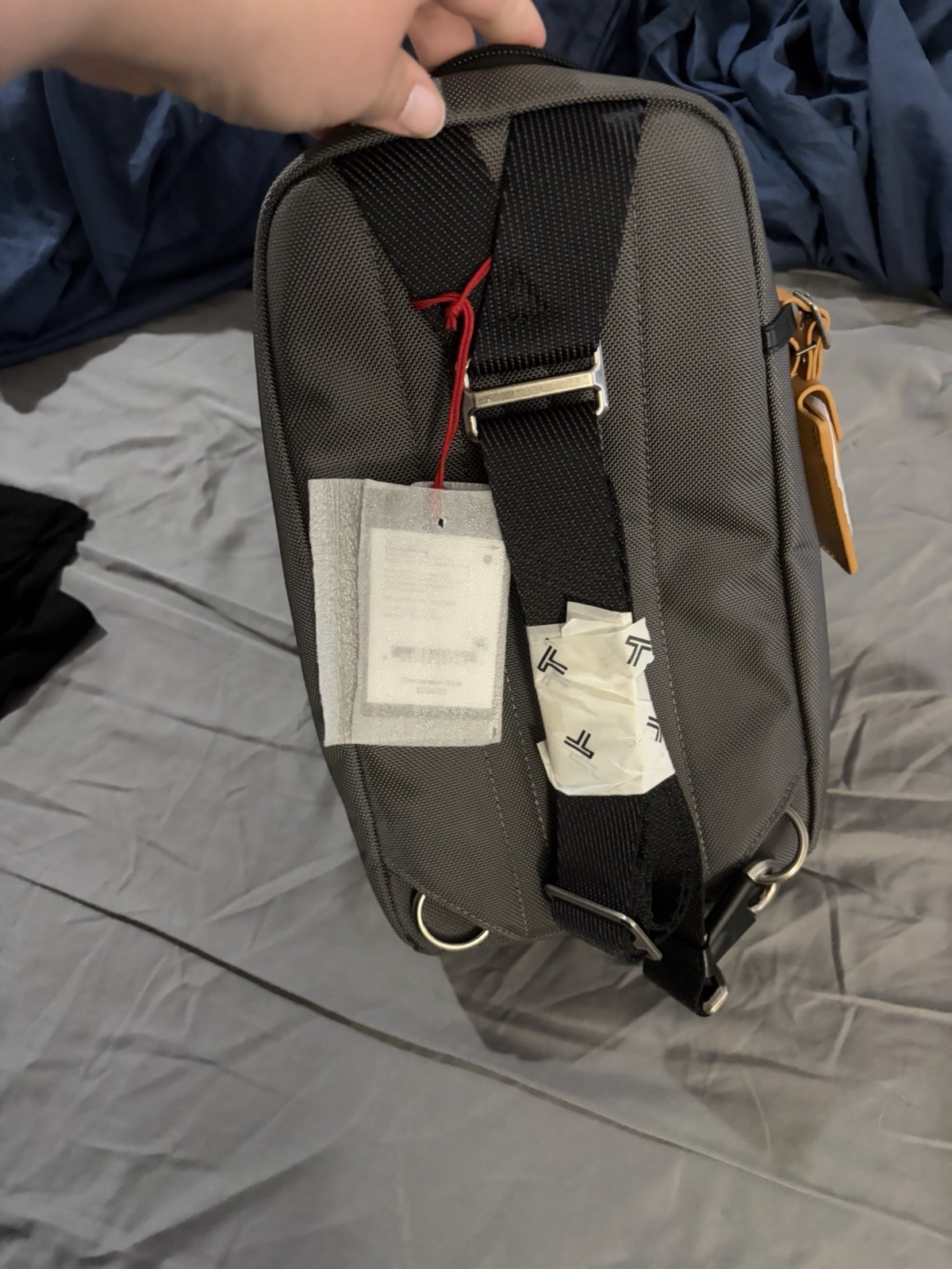 Tumi Gray/Black Small Crossbody Sling Bag Zip Closure, Adjustable Strap, Pockets