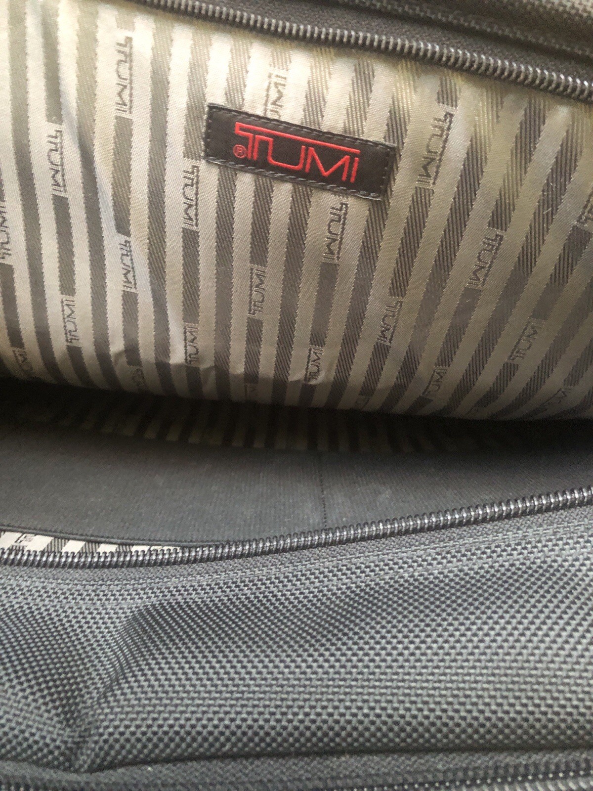 TUMI Model Number: 26041D4 Expandable Organizer Nice condition with shoul strap