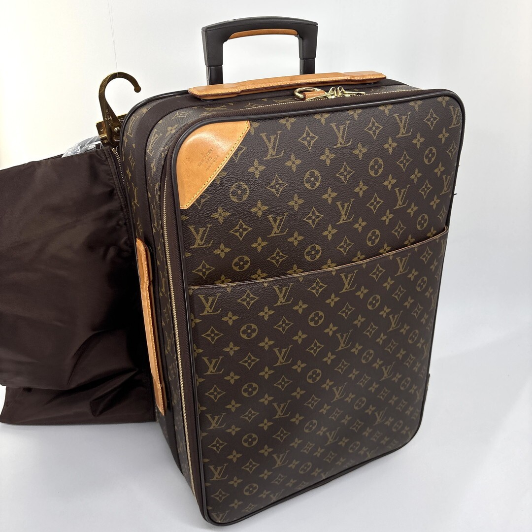 Louis Vuitton M23294 Monogram Pegase 55 carry-on suitcase in brown.