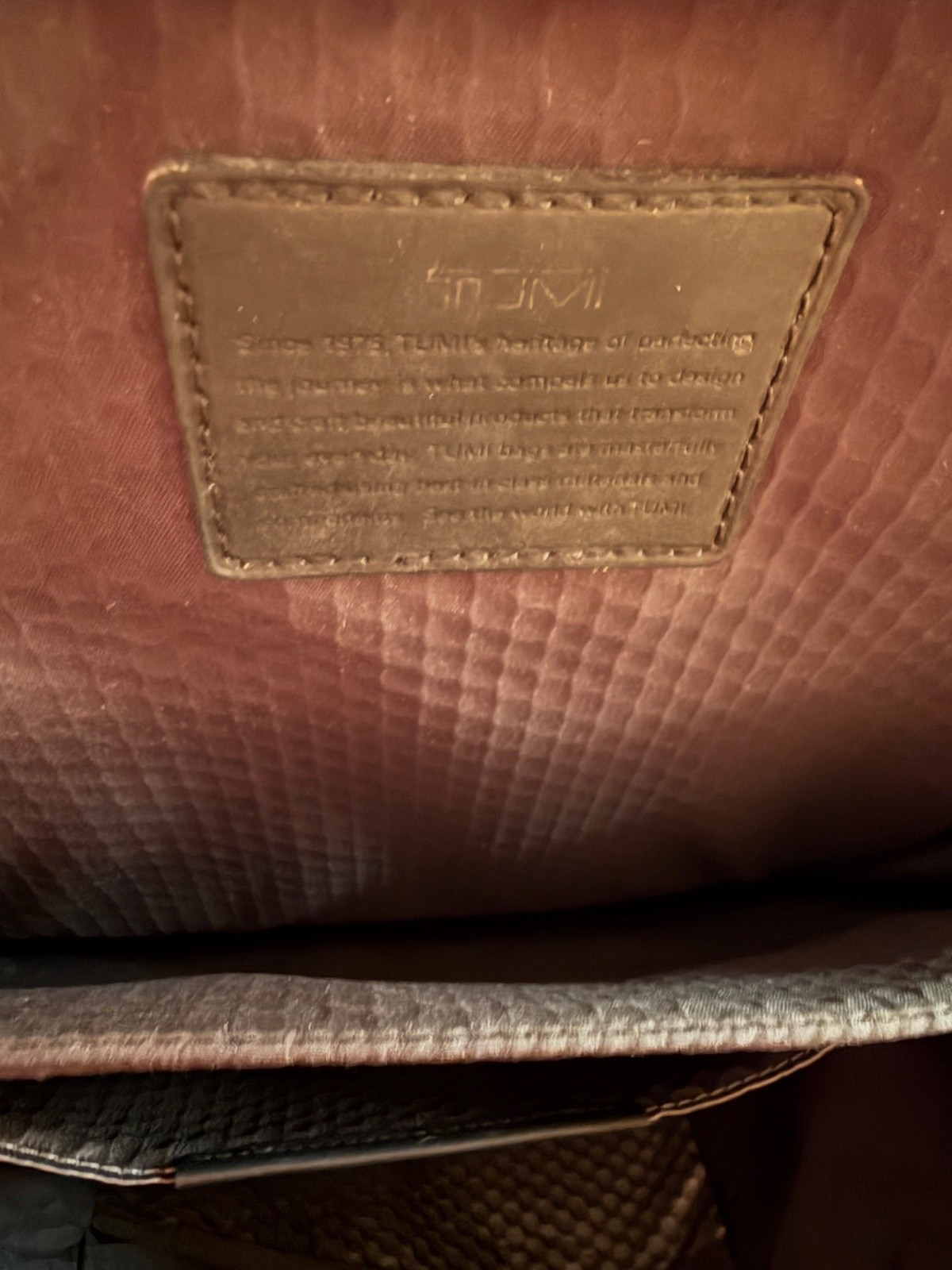 tumi backpack gray and black – has a couple of marks shown in pictures