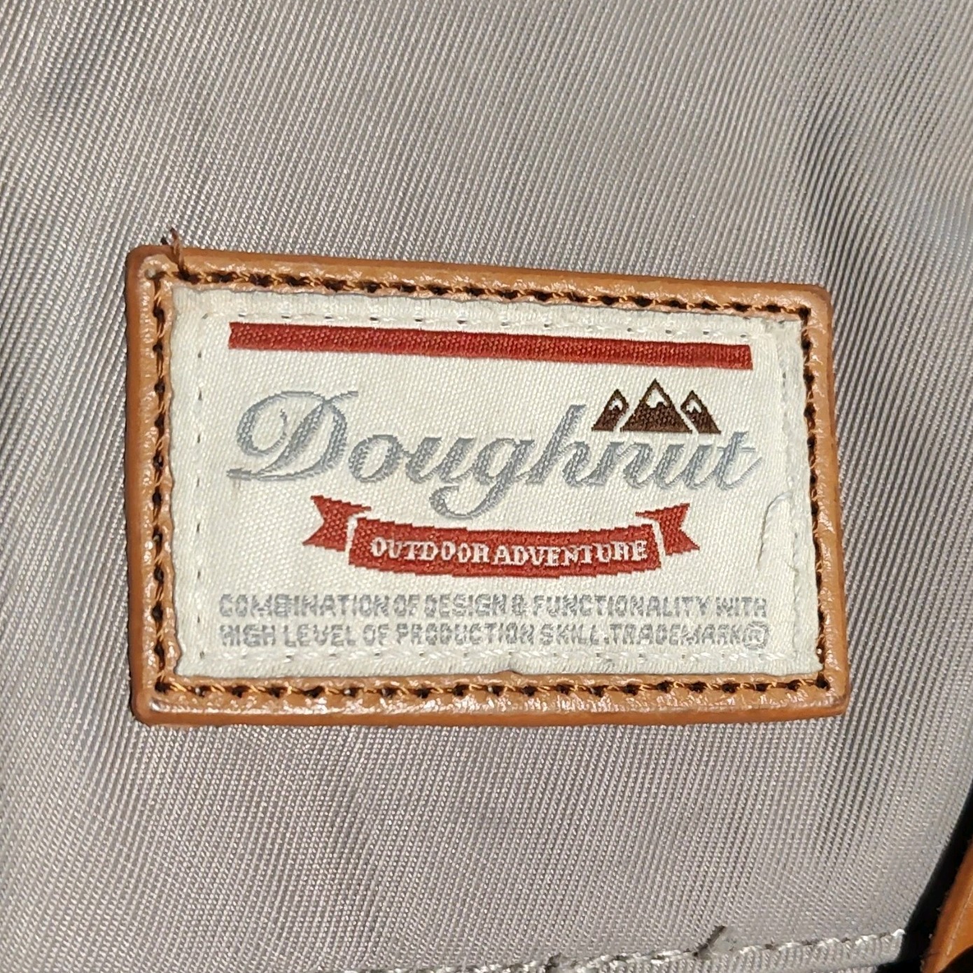 Doughnut Outdoor Adventure Backpack Beige Adjustable Strap Front Pocket