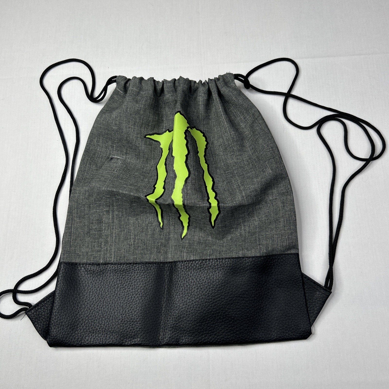 Monster Energy Drawstring Cinch Backpack Gray Front Zipper Pocket Green Logo