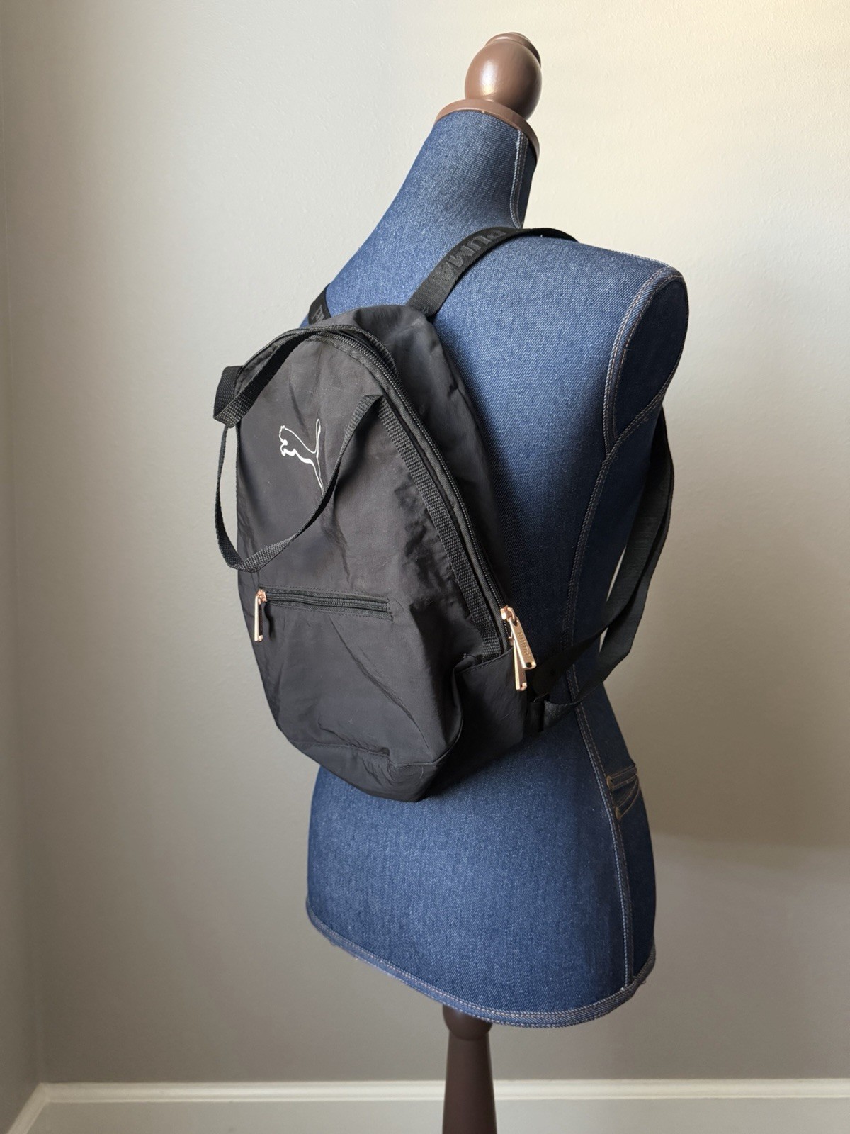 small black puma backpack w/ rose gold hardware
