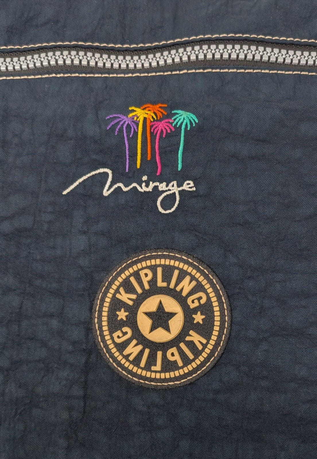 Kipling Madhouse Postman Bag Mirage Las Vegas Logo Expandable Messenger Bag Blue